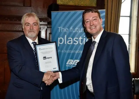 Simon Clarke (right) presenting the OCS certificate to David Jones, group health, safety and environment manager at PD Ports Photo: PD Ports