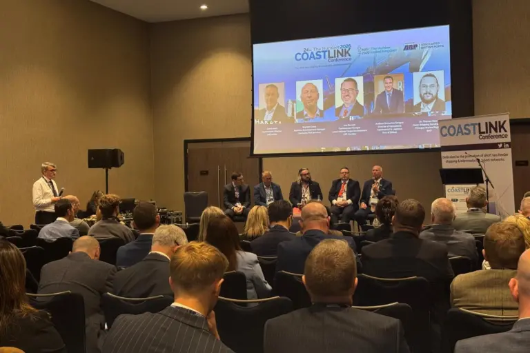 Speakers onstage at the panel discussion on growth and transformation in roro shipping