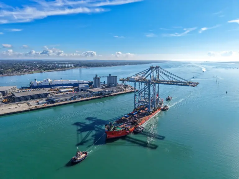 Port of Southampton from the air showing quay cranes arriving