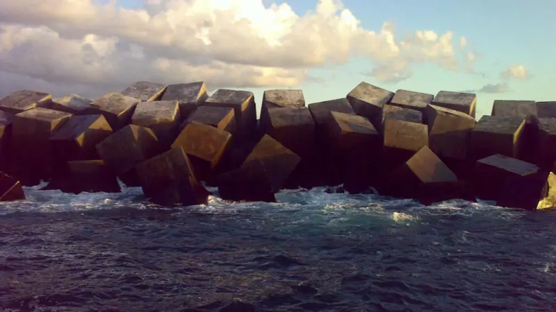 The armour blocks on the breakwater needed careful alignment