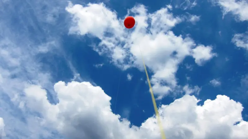 Flying high: a simple, stationary tethered balloon can act as lift infrastructure