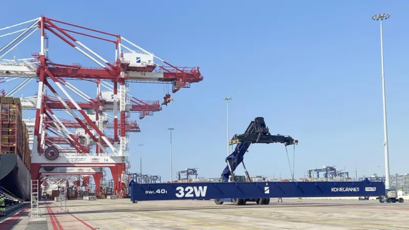 The image shows electric terminal equipment on the quayside at Hutchison Ports BEST at Barcelona Port