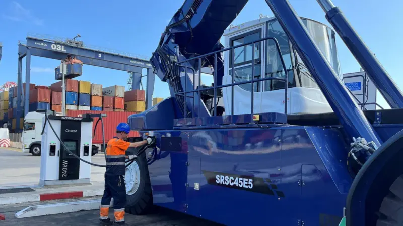The image shows Sany's electric reach stacker at BEST