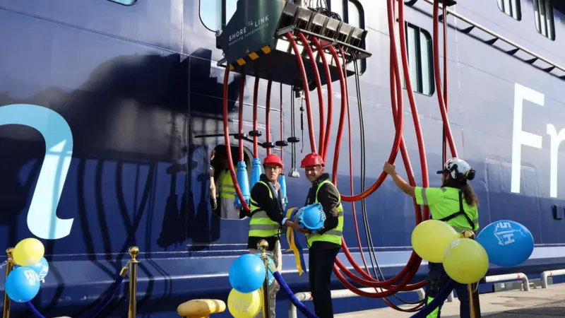 The image shows TUI Cruises´s brand new vessel Mein Schiff 7 connected to the new OPS system
