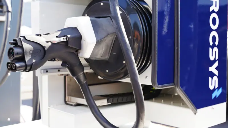 The image shows a close-up of Rocsys autonomous charging technology