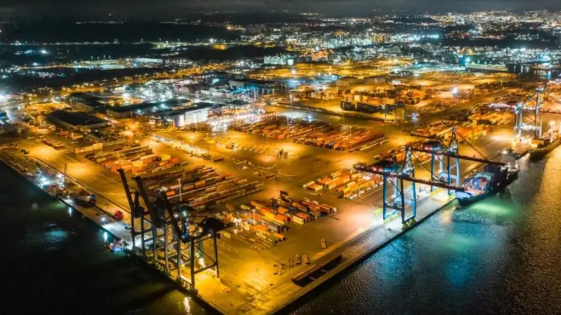 The image shows an overhead shot of Gothenburg container terminal at night