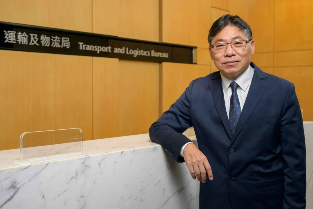 The picture shows Mr Lam Sai-hung standing facing the camera