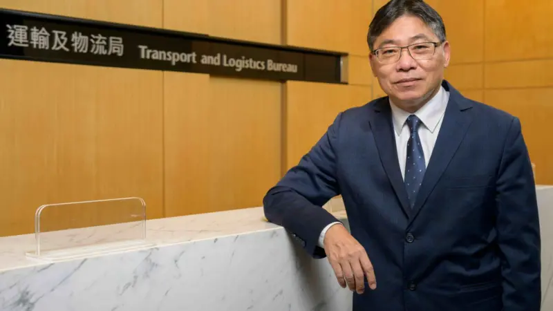 The picture shows Mr Lam Sai-hung standing facing the camera