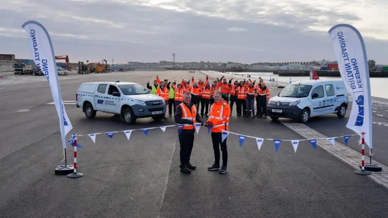 The image shows two ABP representatives cutting the ribbon on the LEEF site