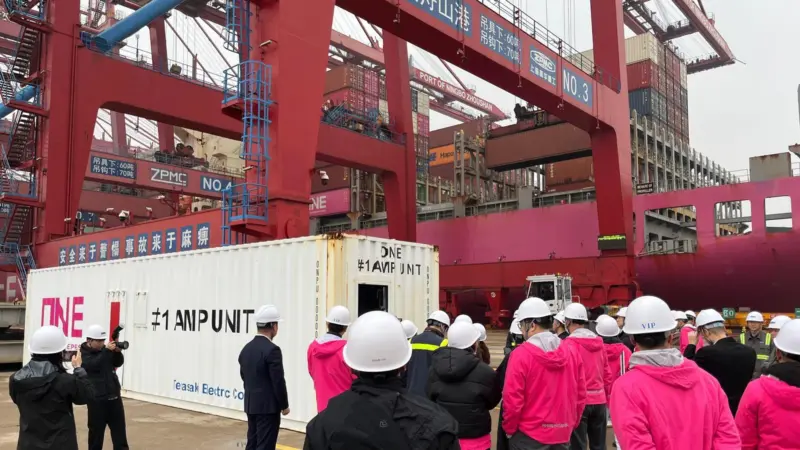 The image shows ONE’s AMP container beng lifted into place at NZPG’s terminal