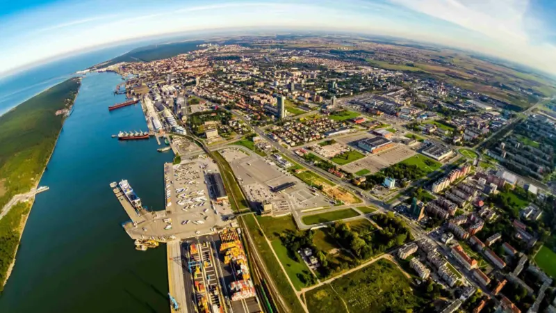 The image shows an overhead photo of the Port of Klaipėda