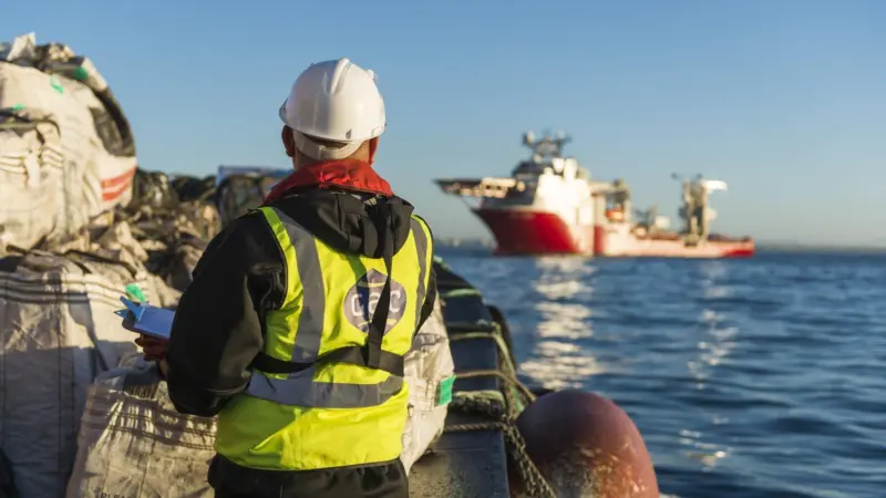 Ship supply launch approaching Multi-Purpose offshore vessel