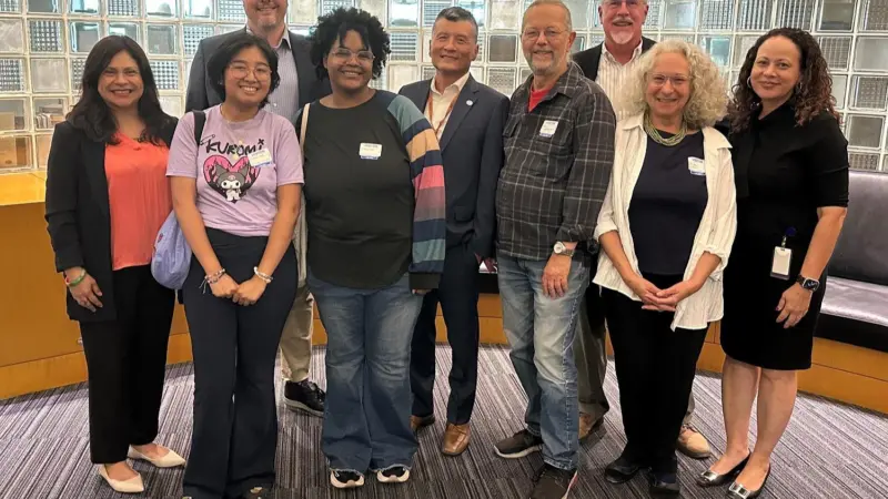 The image shows a shot of Rose Foundation representatives