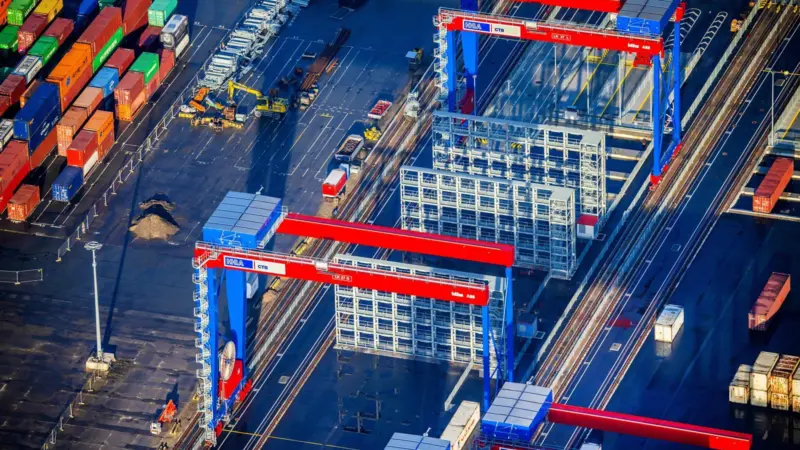 The images shows state-of-the-art port equipment in action at HHLA Container Terminal Burchardkai (CTB) in Hamburg