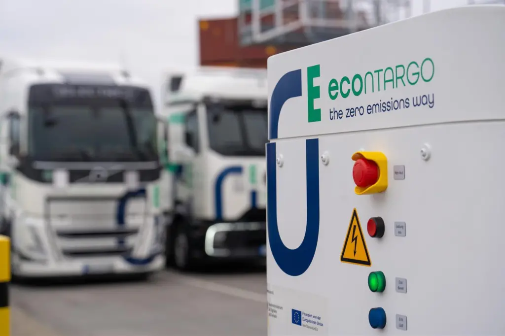 The image shows a Contargo e-truck charging facility