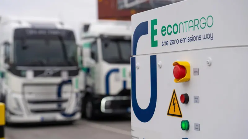 The image shows a Contargo e-truck charging facility