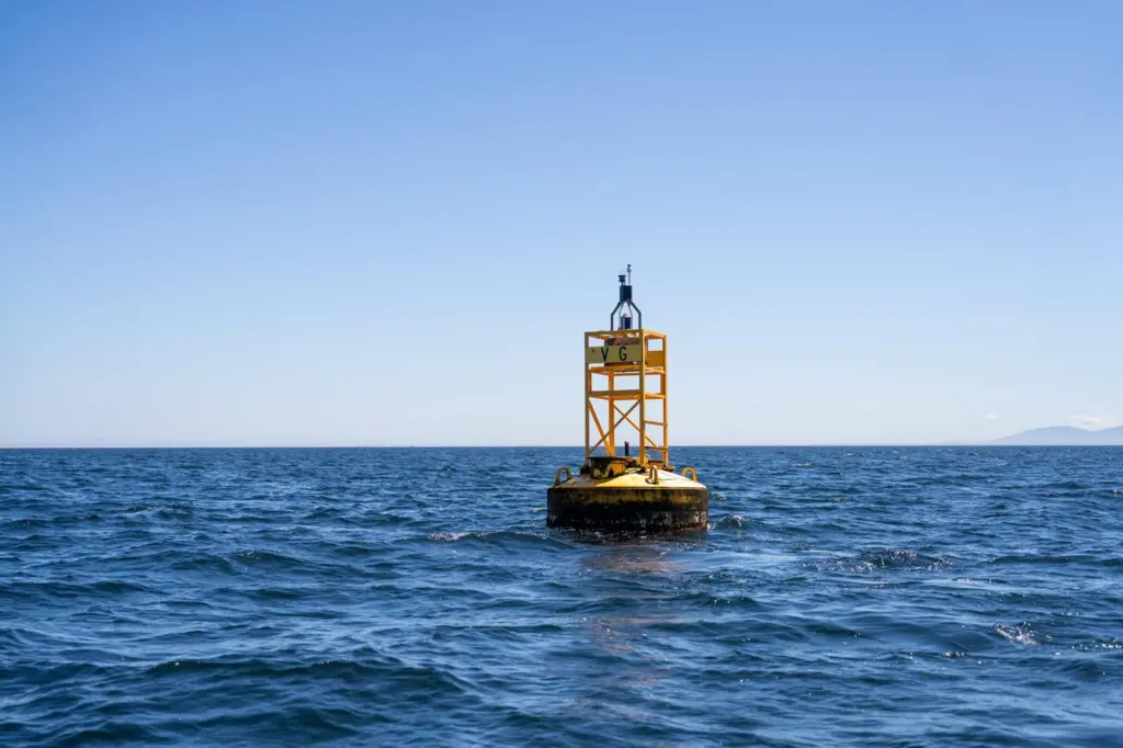 The image shows MarineLabs monitoring technology attached to a harbour buoy