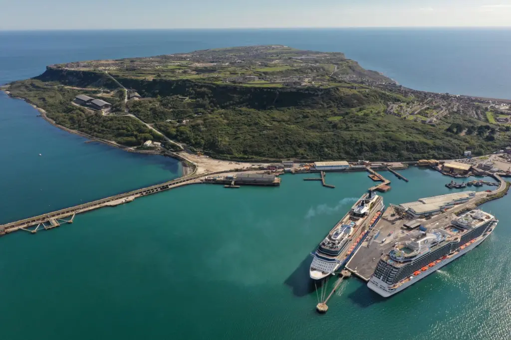 The photo shows an overhead shot of Portland Port in Dorset, UK