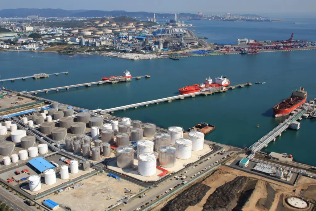 The image shows a wide angle shot of a vessel in berth at Ulsan's tank terminal