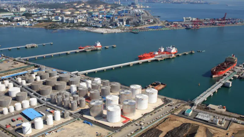 The image shows a wide angle shot of a vessel in berth at Ulsan's tank terminal