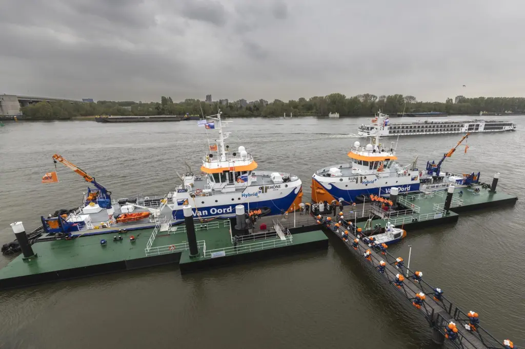 The image shows the christening service of Van Oord's two new hybrid water injection dredgers (WIDs), Rijn and Rhône