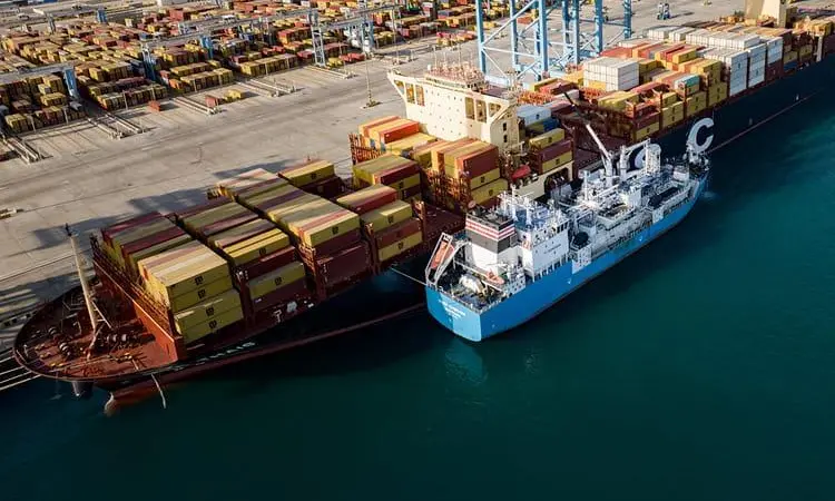 The photo shows the container vessel MSC Thais refuelling from the Green Zeebrugge, operated by marine fuels provider Monjasa