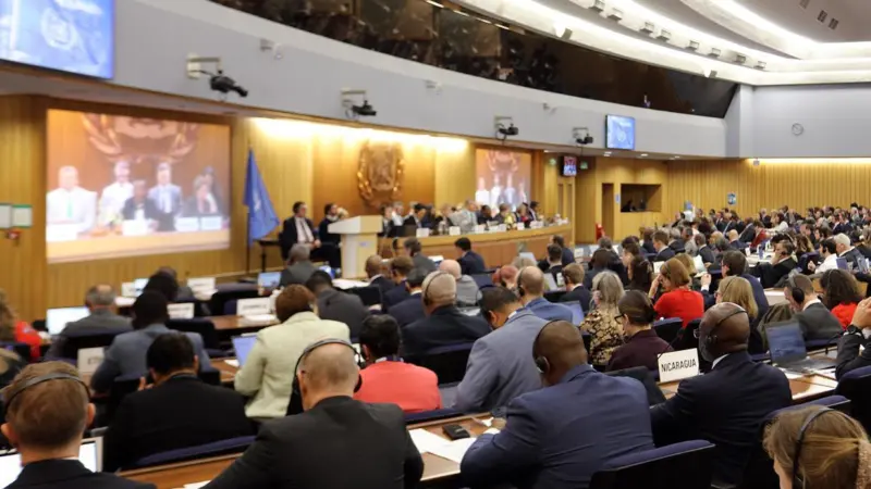 The photo shows a panoramic shot of the IMO's MEPC 83 meeting from 7 to 11 April 2025