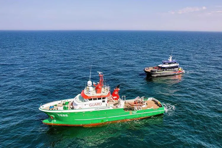 The image shows PD Ports' new Pilot boat and an E tug on the water