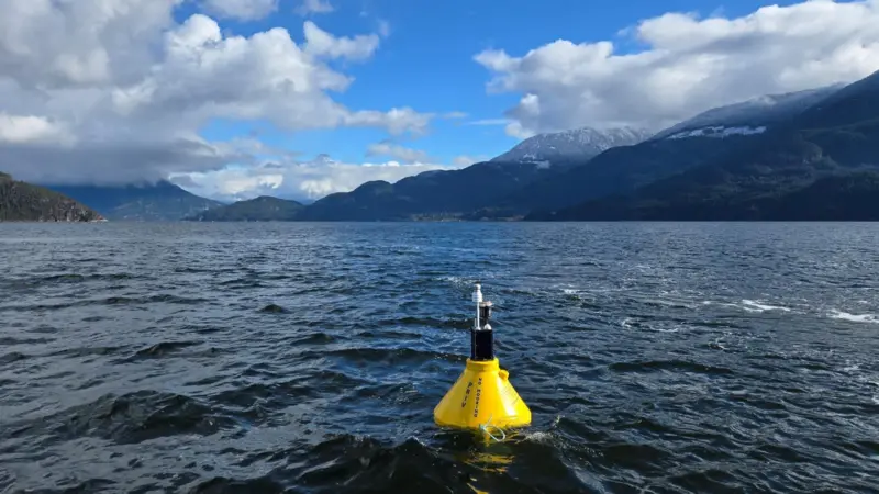 The image shows a MarineLabs buoy on the ocean surface