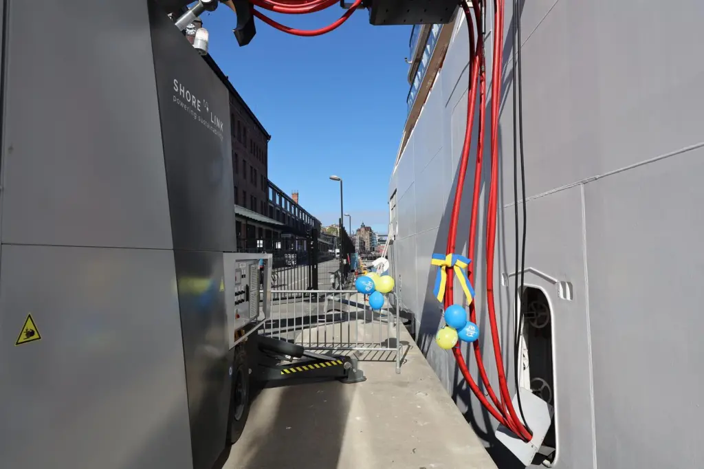 The image shows Viking Jupiter connecting to the new OPS facility on the quayside