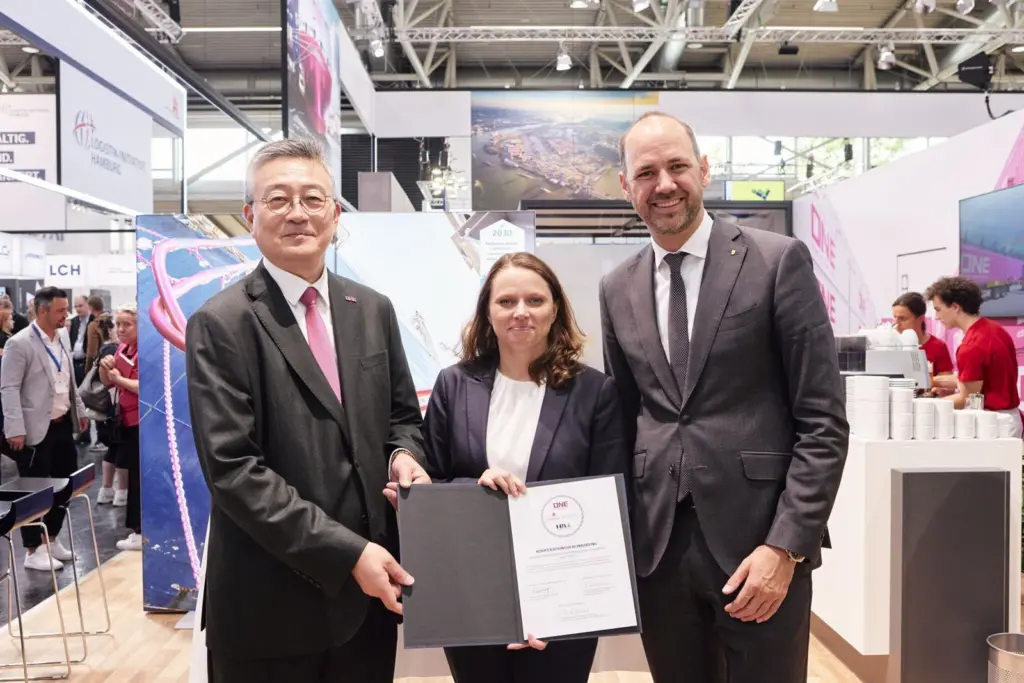 The image shows Hamburg’s Senator for Economic Affairs Dr Melanie Leonhard, HPA CCO Friedrich Stuhrmann and ONE’s managing director, Takahiro Kikuchi, signing the agreement at agreement was formalised at the Transport Logistic 2025 trade fair
