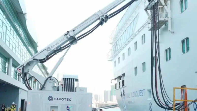 The image shows a Cavotec shore power system in action