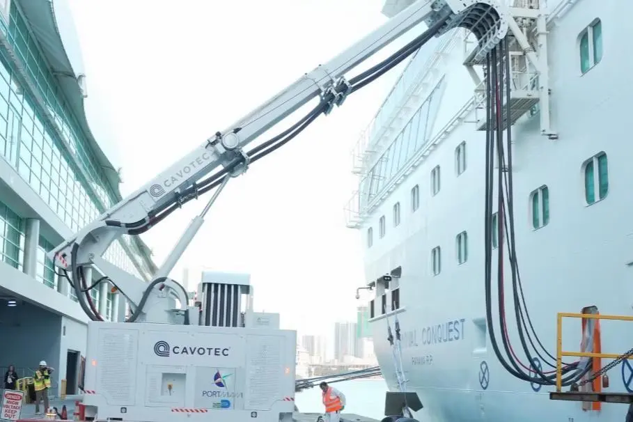 The image shows a Cavotec shore power system in action