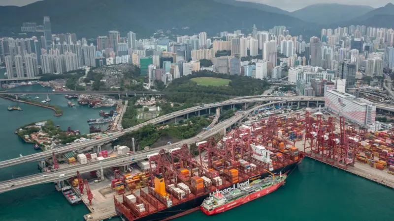 The image shows an overhead shot of the bunkering operation at the Port of Hong Kong