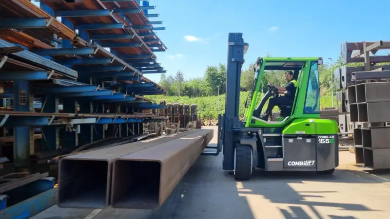 The image shows the Combi-CB70E at work in a yard