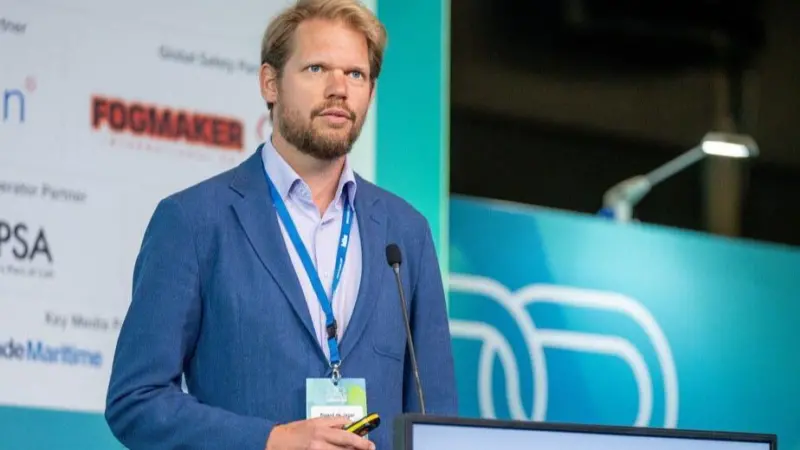 The image shows Sjoerd de Jager, managing director of PortXchange on the podium at TOC
