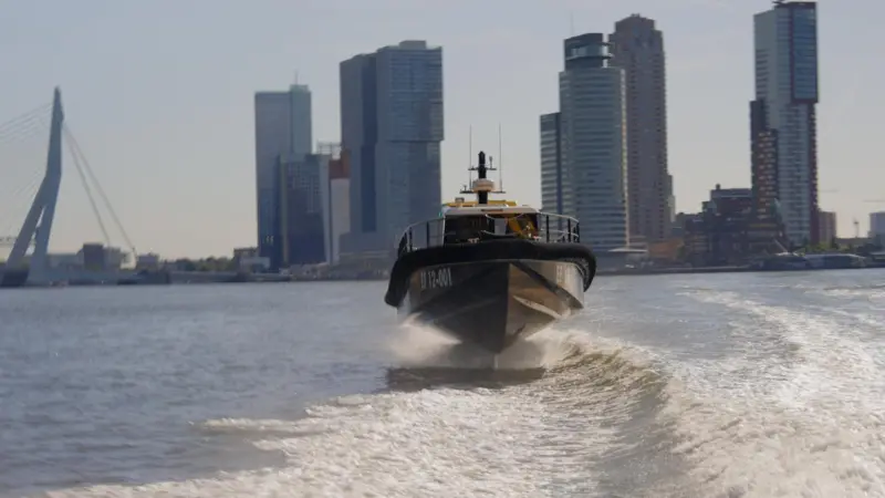 The image shows the Artemis EF-12 on the water at Rotterdam