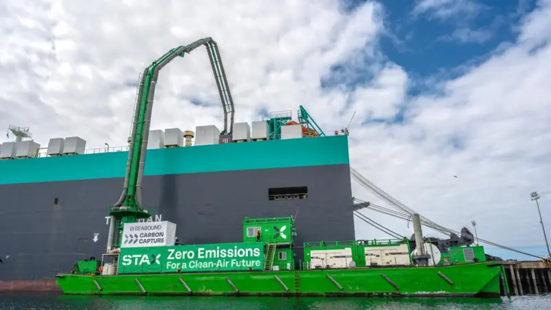 Green STAX vessel capturing carbon at a port