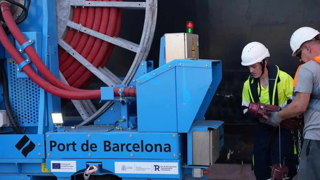 Two engineers looking at a shorepower connection at the BEST terminal in Barcelona
