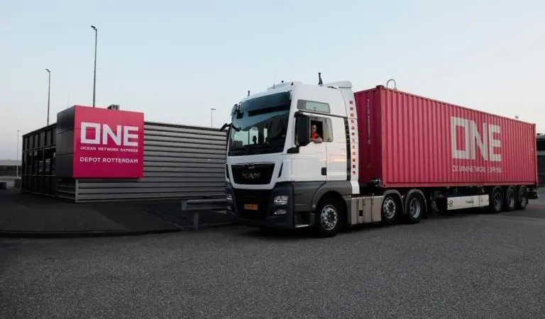 The image shows a ONE truck at QTerminals Kramer Rotterdam