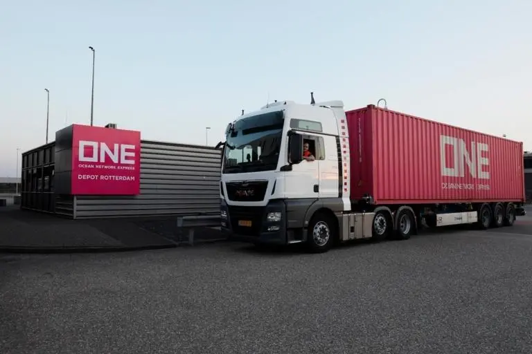 The image shows a ONE truck at QTerminals Kramer Rotterdam
