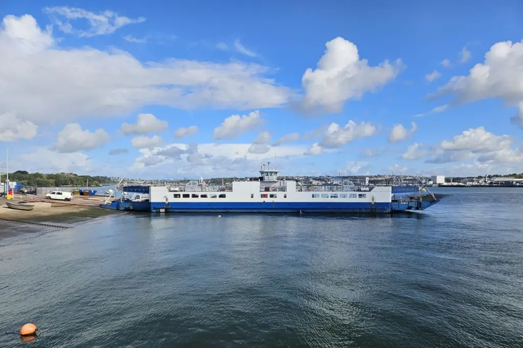 The image shows the Torpoint ferry on the water