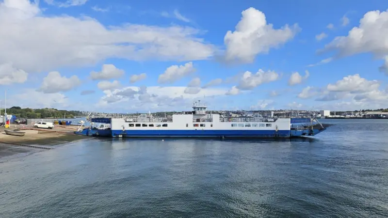 The image shows the Torpoint ferry on the water