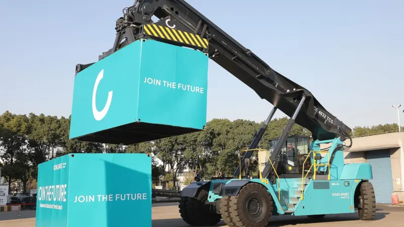 Konecranes new electric reach stacker in operation lifting boxes on the quay side