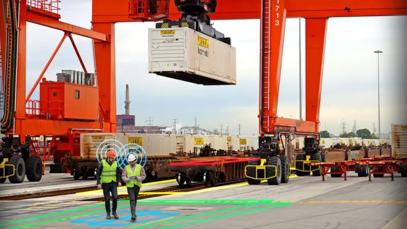 A picture of a container being lifted on the quayside
