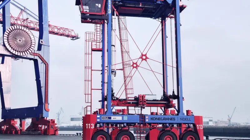 An image of the Konecranes hybrid straddle carrier on the quayside