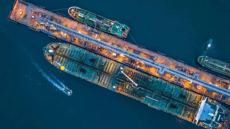 An image of vessels berthing at a terminal