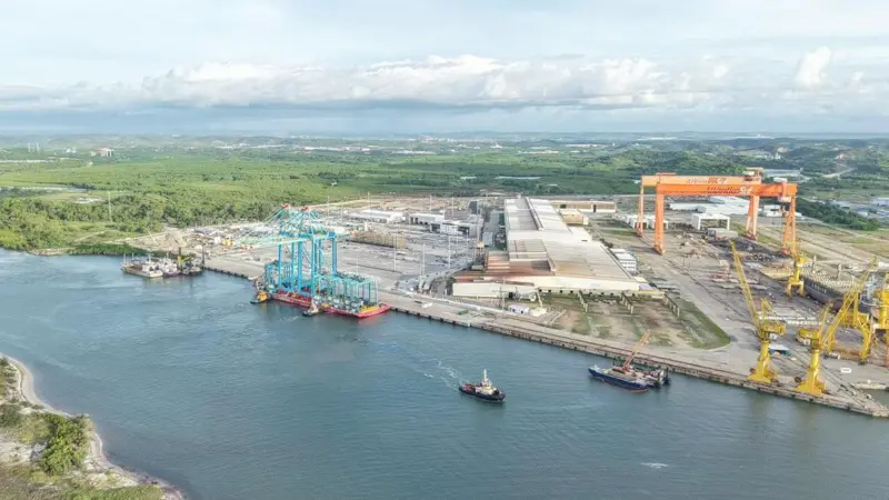 The image shows the new electric port equipment on the quayside