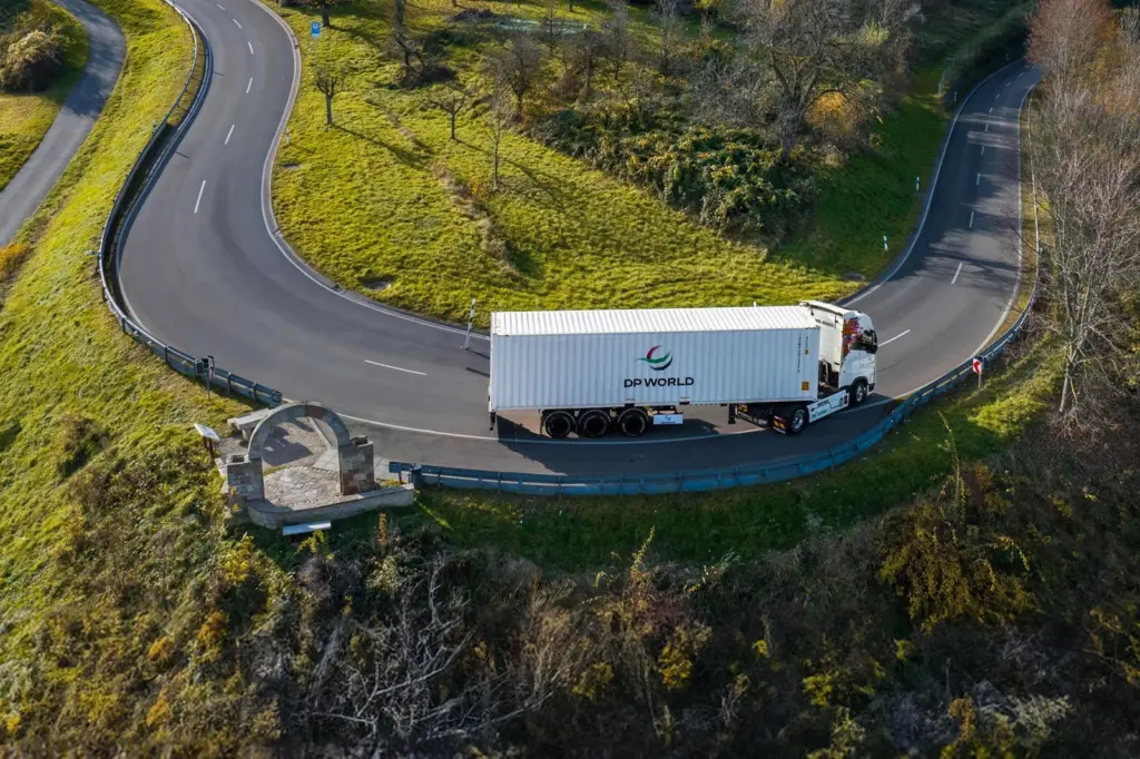 A picture of a DP World branded freight truck on the road