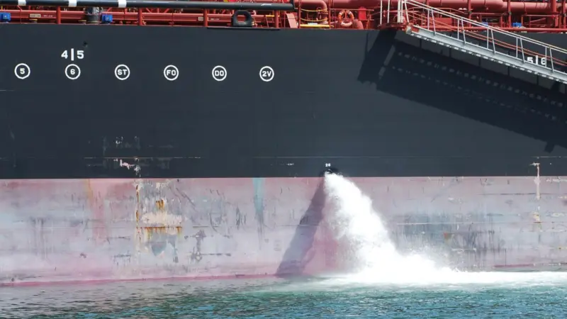 Ballast water being discharged from a ship